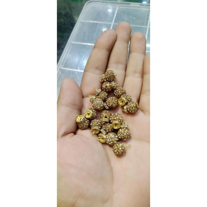 Golden stone button