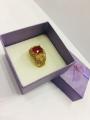 Ring gold plated one carat with white stones and ruby for women. 