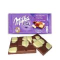 Milka Happy Cows Milk and White Chocolate Bar (100 grams). 