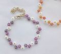 Small beaded bracelet in flower petal design. 