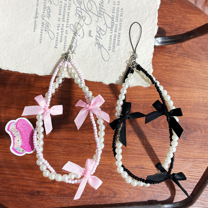 Korea ins pearl bow ribbon mobile phone chain lanyard versatile black and white hanging ornament small fragrance wind beaded pendant