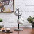 One Piece Black Metal Coffee Mug Tree Rack with 4 Curved Hooks and  Wood Base customized by the Decor Dictionary. 