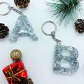 1x keychain- golden / silver- Initial keychain- glittered with foil- fancy keychain- Resin- Epoxy. 