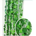 Pack of 1 artificial garland green leaf bail 6.9 ft natural look for decoration artificial flowers. 
