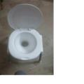 Plastic Material Over The Flush Usage Commode Seat With Four Strong Steel Legs. 