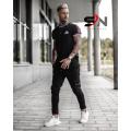 Black Designer Printed Tracksuit For Men Round Neck T Shirt For Mens and Pocket Style Trouser For Mens Summer Printed Tracksuit. 