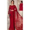 An elegant saree featuring bejewelled neckline and delicate embroideries, pearls, diamonites, sequins and hand cut 3D floral appliques with signature sophisticated cutwork detaling in an ethereal shade of Red.. 