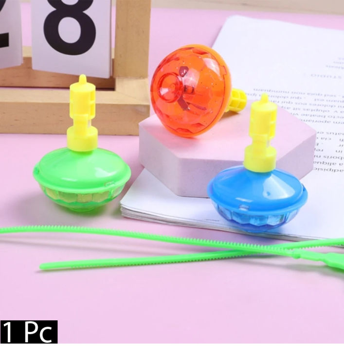 2 Toupies Musicales Lumineuses Avec Lanceur – UFO Spinner – Couleur Aléatoire – Cadeau Enfant