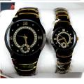 A classic analog wristwatch with a white dial, black Arabic numerals, and a white leather strap.. 