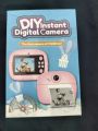 Kids Digital Camera Toy – 12MP Instant Print Camera with Selfie Mode & Music (Pink). 