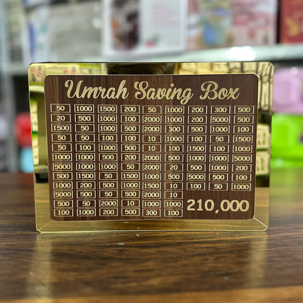 New%20Wooden%20Umrah%20Saving%20Jar%20with%20280-Day%20Target%20System%20%E2%80%93%20Beautiful%20Islamic%20Design%20Featuring%20Makkah%20&%20Madinah%20%E2%80%93%20Daily%20Coin%20Deposit%20Idea%20for%20Long-Term%20Pilgrimage%20Planning%20%E2%80%93%20Suitable%20for%20Eid,%20Nikah%20&%20Ramadan%20Gifting%20-%20Image%205