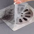 The Disposable Shower Drain Mesh Sticker Hair Catcher is a self-adhesive, disposable mesh that catches hair and debris to prevent clogs. Easy to apply and perfect for sinks, bathtubs, and laundry drains.. 