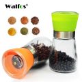 Pepper grinder crusher chopper with organic black peppercorns. 