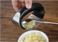 Stainless Steel Garlic Press Rocker - Premium Garlic Mincer With Silicone Peeler & Scraper - Arc Shape Design Garlic Crusher With Comfortable Grip Used For Peeling Garlic Ginger Lemmon And More. 