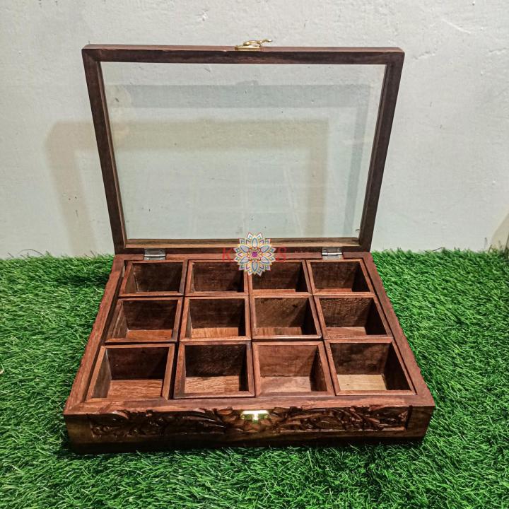 Spice%20Container%20(%20Masala%20Box%20)%20Made%20of%20Pure%20Rose%20Wood%20with%20Hand%20Carving%20Having%2012%20removable%20boxes%20with%20capacity%20of%20over%20100%20Gram%20(Powder%20Spices)%C2%A0with%C2%A0Glass%C2%A0Lid%20and%20one%20Spoon%20-%20Image%206