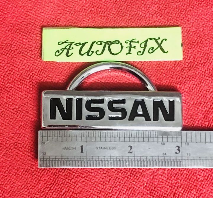 Nissan%20Plastic%20Logo%2003%20Inches%20Silver%2001%20PC%20-%20Image%202