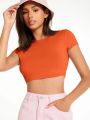 SOLID MOCK NECK CROP TOP Discover the Allure of Solid Mock Neck Crop Tops". 
