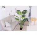 Imported artificial  Monstera Plant with black planter. 