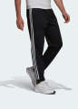 Adidas ESSENTIALS WARM-UP TAPERED 3-STRIPES TRACK PANTS. 