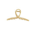 The Hair Edit Gold French Twist Claw Clip. 