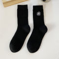 Medium socks women's winter thick small fragrance embroidery camellia cashmere socks ins tide black and white wool socks wholesale. 