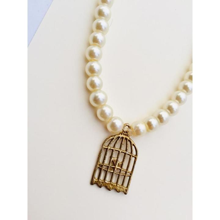 Girls beautiful pearl necklace with cage pendant with cream colour