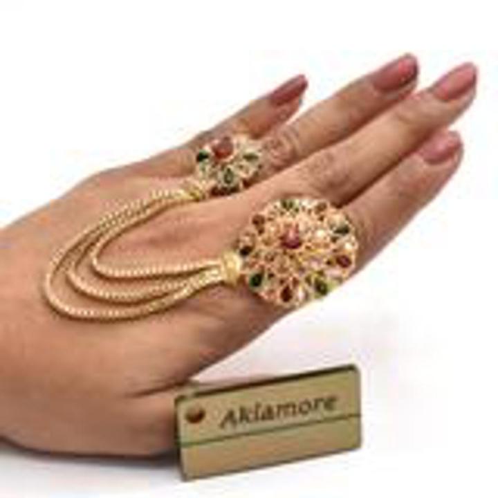 stylish double ring with green and maroon nug