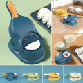 Dumpling maker with a box that can make two dumplings at once. 