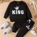"Keep Your Baby Boy Stylish and Comfy with a King Letter Print Tracksuit - King Letter Print Sweatshirt & Trousers Set". 