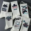 Graffiti socks men's ins, trendy and versatile, high-value mid-cut autumn student sports basketball socks, long tide men's stockings. 