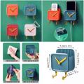 One Multipurpose Clock Shape Wall Mobile Holder Self Adhesive With 2 Hook | Mobile Charging Stand | Home Decoration Item Keys Hanging Hooks | Wall Mount Hanging Stand For Keys | Home AC TV Remote Holder | Wall Mounted Self Adhesive Key Holder Multi Colors. 