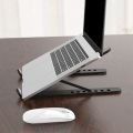 Foldable laptop stand for bed lightweight ventilate portable laptop stand with 7-Level adjustable Height for 11 - 15 Inch notebook stand ABS High Quality plastic laptop stand with aluminum center rod and non-slip silicon grip. 