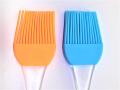 2 Pcs Brushing roasting pan with oil using a pastry brush. 