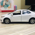 Toyota Corolla Grande Diecast Metal Model Toy Car Collection With Lights and Sounds Pull Back Action - Size Approx. 5 Inch - White. 