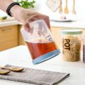 【FUN LIVE】 700/900Ml Plastic Storage Can With Scale Sealed Tank Stackable Dried Fruit Tea Coarse Cereals Sealed Jar Kitchen Accessories. 