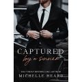 Captured by a Sinner by Michelle Heard. 