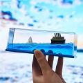 Wave Cruise Ship Decoration Unsinkable Titanic Model in a Clear Motion Bottle for Stress Relief, Office or Home, Gift & Paperweight - Soothing Blue Liquid with Floating Ship Design. 