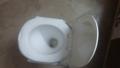 Plastic Material Over The Flush Usage Commode Seat With Four Strong Steel Legs. 