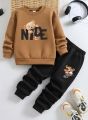 "Kids Winter Tracksuit - Cute Teddy Bear Printed Sweatshirt & Jogger Set for Boys & Girls (2-Piece)". 