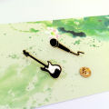 European and American simple fashion creative cute rock guitar microphone metal brooch badge male pin bag accessories women. 