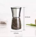 Pepper grinder crusher chopper with organic black peppercorns. 