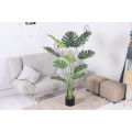 Imported artificial  Monstera Plant with black planter. 