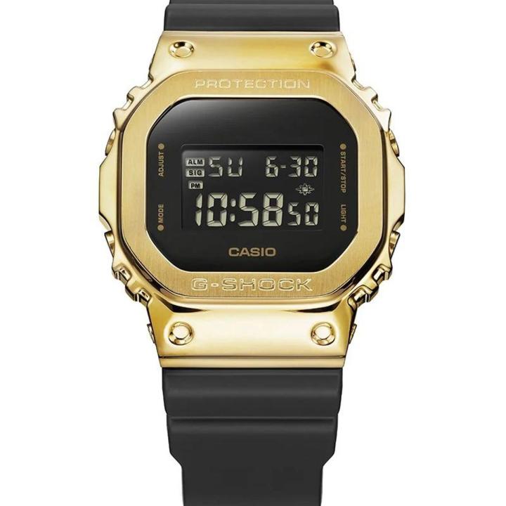 Casio G Shock 5600 Series Square Digital Gold Ion Plated Bazel Stop Watch Hourly Time Signal Full Auto Calender (to year 2099) Flash Alert Electro-Illuminator Backlight Multi-Functions Black Resin Band Watch-GM-5600G-9DR