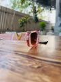Stylish Pink Transparent Frame Women’s Sunglasses – Golden V Side Logo, UV Protection, Fashion Look. 
