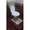 Plastic Material Over The Flush Usage Commode Seat With Four Strong Steel Legs. 