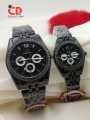 CD COLLECTION COUPLE WATCHES METALLIC CHAIN AND CUT CASE WITH PUSH BUTTON LOCK DIFFERENT COLOURS AVAILABLE WITH FREE BOX. 