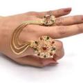 stylish double ring with green and maroon nug. 