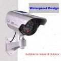 Solar Powered dummy Security Camera, Bullet Dummy Surveillance  System with Realistic Red Flashing Lights and Warning Sticker Indoor Outdoor (1, Silver). 