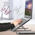 This is a high-quality, portable laptop stand that folds up and is adjustable in height. It features an adjustable cooling bracket and a multifunction aluminum lap mount computer tablet support riser holder that can be adjusted up to 15.6 inches. It is ma. 