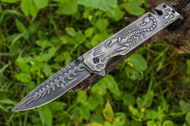 Foldable pocket knife with a scorpion pattern